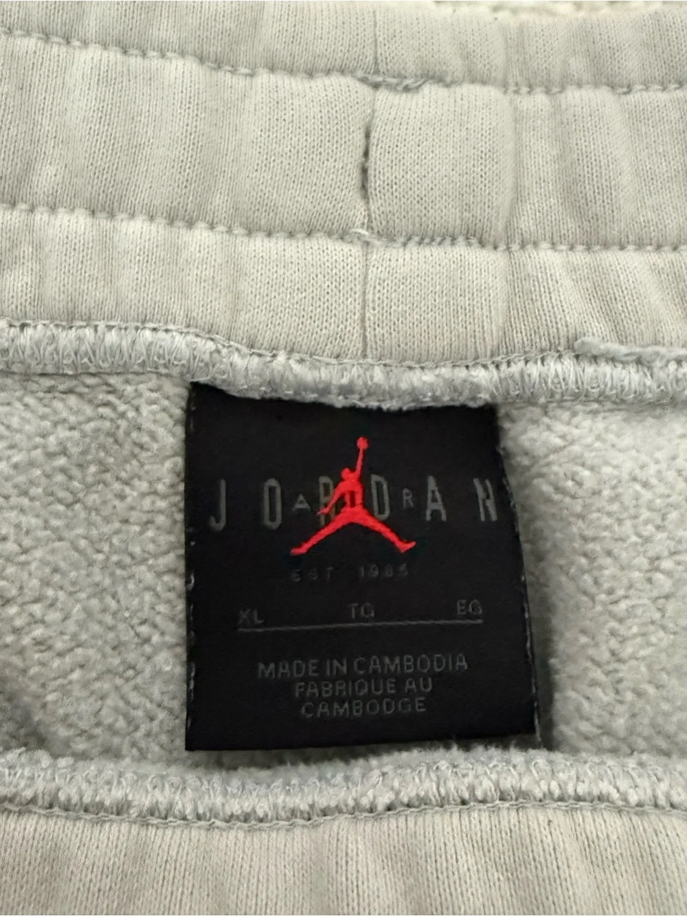 Jordan Light Gray Joggers with Orange & White Jump Graphic